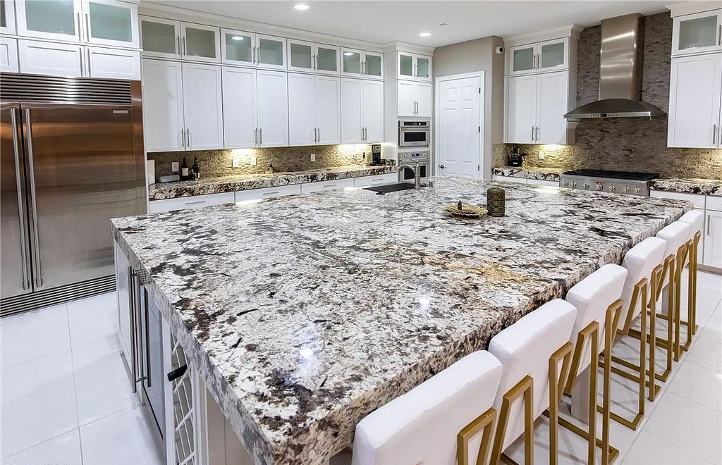 89 Olympia Chase Drive, Las Vegas, Nevada is a stunning executive home in the highly sought-after Southern Highlands Country Club Community with many designer finishes throughout for entertaining and relaxing.