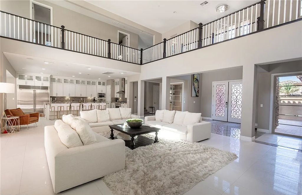 89 Olympia Chase Drive, Las Vegas, Nevada is a stunning executive home in the highly sought-after Southern Highlands Country Club Community with many designer finishes throughout for entertaining and relaxing.