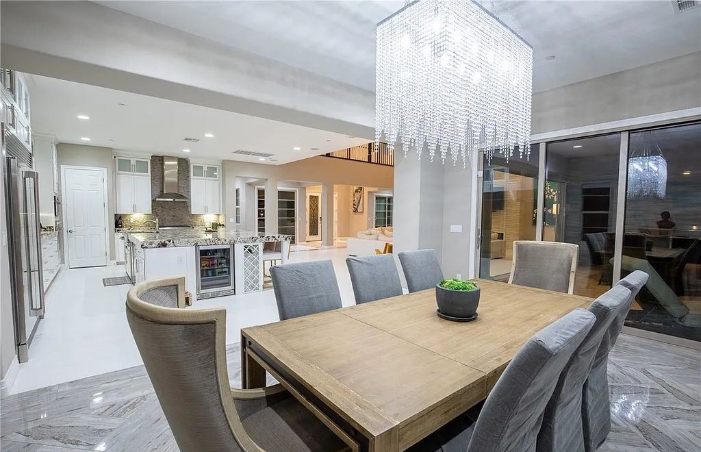 89 Olympia Chase Drive, Las Vegas, Nevada is a stunning executive home in the highly sought-after Southern Highlands Country Club Community with many designer finishes throughout for entertaining and relaxing.