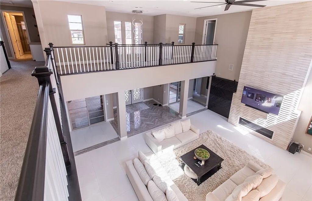 89 Olympia Chase Drive, Las Vegas, Nevada is a stunning executive home in the highly sought-after Southern Highlands Country Club Community with many designer finishes throughout for entertaining and relaxing.