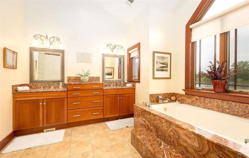 The Estate in Godfrey is a luxurious home with built-in lighting perfect for family fun, now available for sale. This home located at 702 Seiler Rd, Godfrey, Illinois
