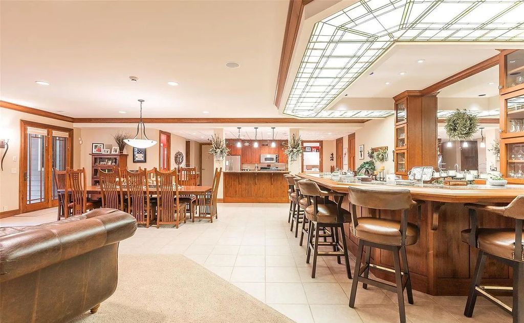 The Estate in Godfrey is a luxurious home with built-in lighting perfect for family fun, now available for sale. This home located at 702 Seiler Rd, Godfrey, Illinois