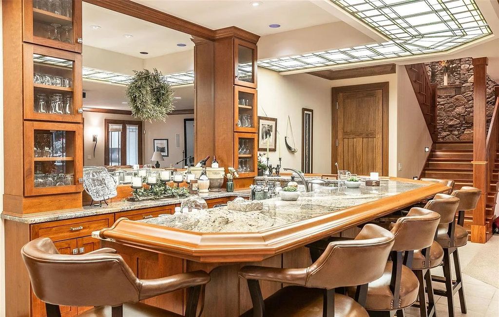 The Estate in Godfrey is a luxurious home with built-in lighting perfect for family fun, now available for sale. This home located at 702 Seiler Rd, Godfrey, Illinois