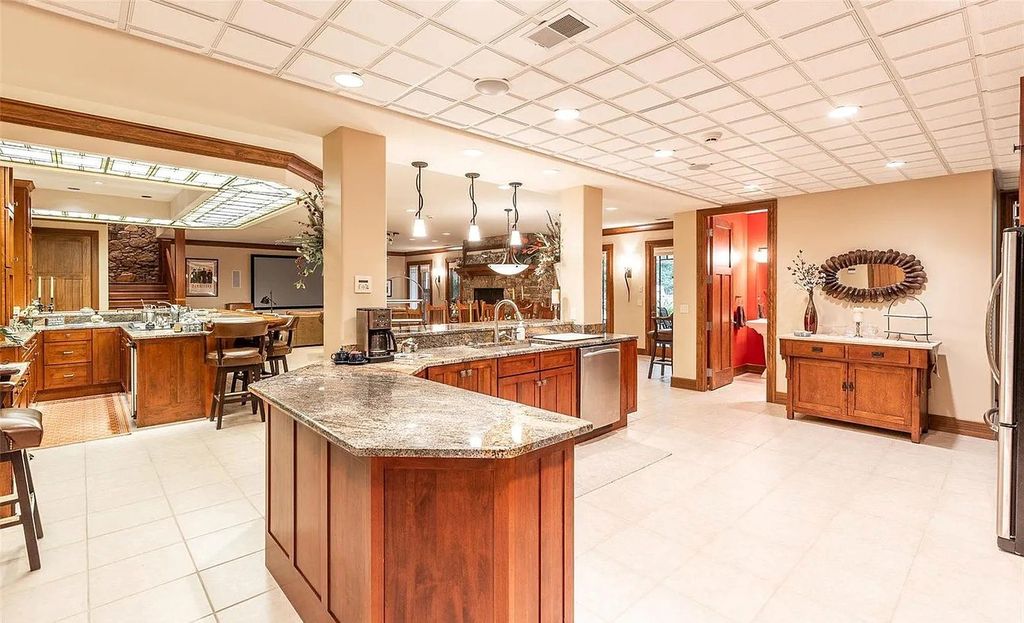 The Estate in Godfrey is a luxurious home with built-in lighting perfect for family fun, now available for sale. This home located at 702 Seiler Rd, Godfrey, Illinois