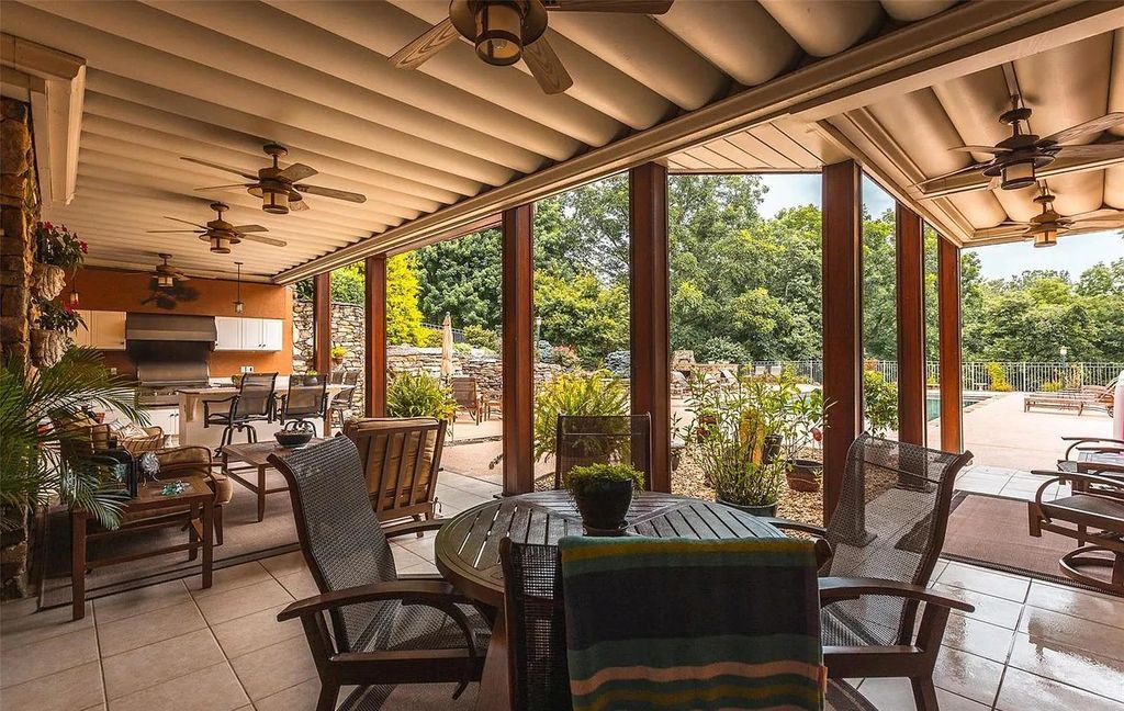 The Estate in Godfrey is a luxurious home with built-in lighting perfect for family fun, now available for sale. This home located at 702 Seiler Rd, Godfrey, Illinois