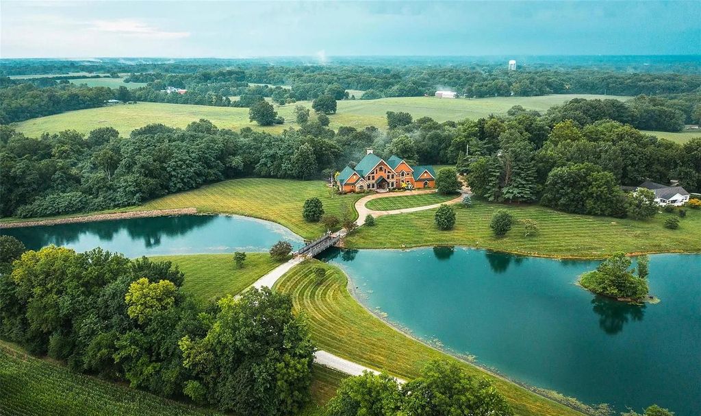 The Estate in Godfrey is a luxurious home with built-in lighting perfect for family fun, now available for sale. This home located at 702 Seiler Rd, Godfrey, Illinois
