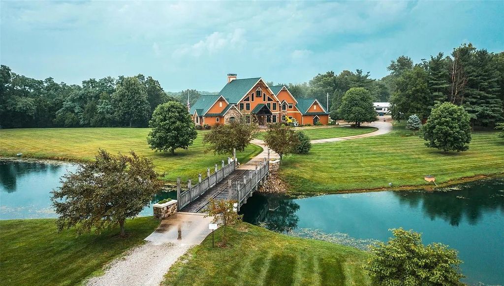 The Estate in Godfrey is a luxurious home with built-in lighting perfect for family fun, now available for sale. This home located at 702 Seiler Rd, Godfrey, Illinois