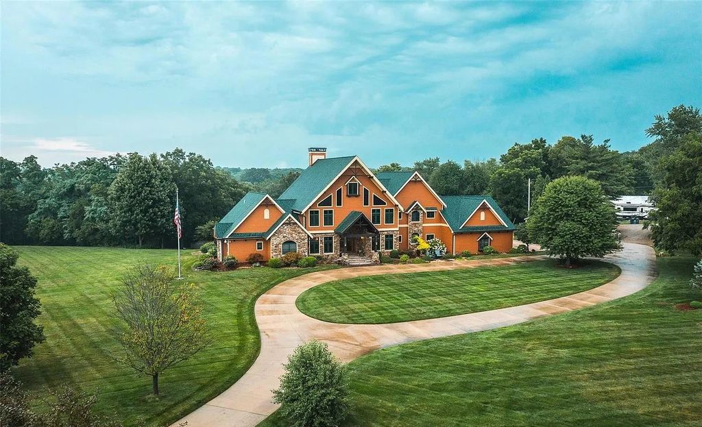 The Estate in Godfrey is a luxurious home with built-in lighting perfect for family fun, now available for sale. This home located at 702 Seiler Rd, Godfrey, Illinois