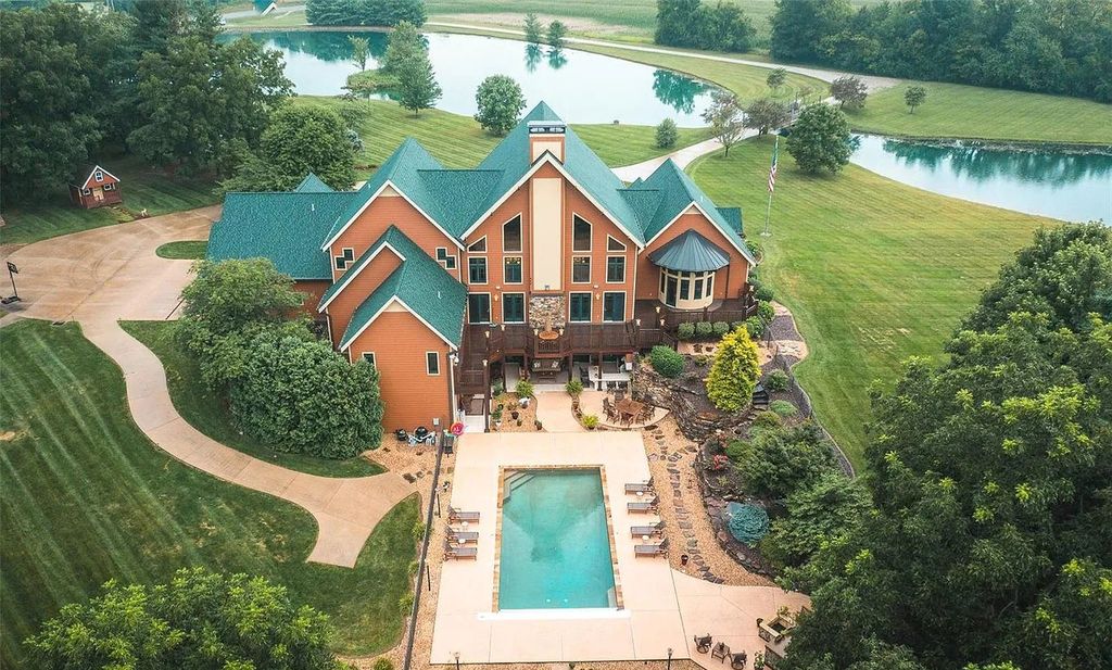 The Estate in Godfrey is a luxurious home with built-in lighting perfect for family fun, now available for sale. This home located at 702 Seiler Rd, Godfrey, Illinois