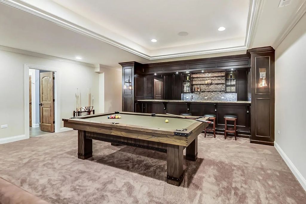 The House in Naperville is a stunning custom home built by a local luxury builder, now available for sale. This home located at 960 E Porter Ave, Naperville, Illinois