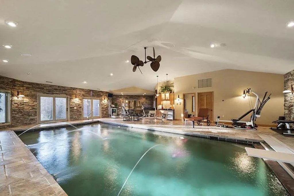 The Estate in Stevens Point is a luxurious home with a gated entrance, a lighted driveway to open up a paradise of entertainment for you now available for sale. This home located at 2688 Scenic Drive, Stevens Point, Wisconsin; offering 03 bedrooms and 05 bathrooms with 7,095 square feet of living spaces.