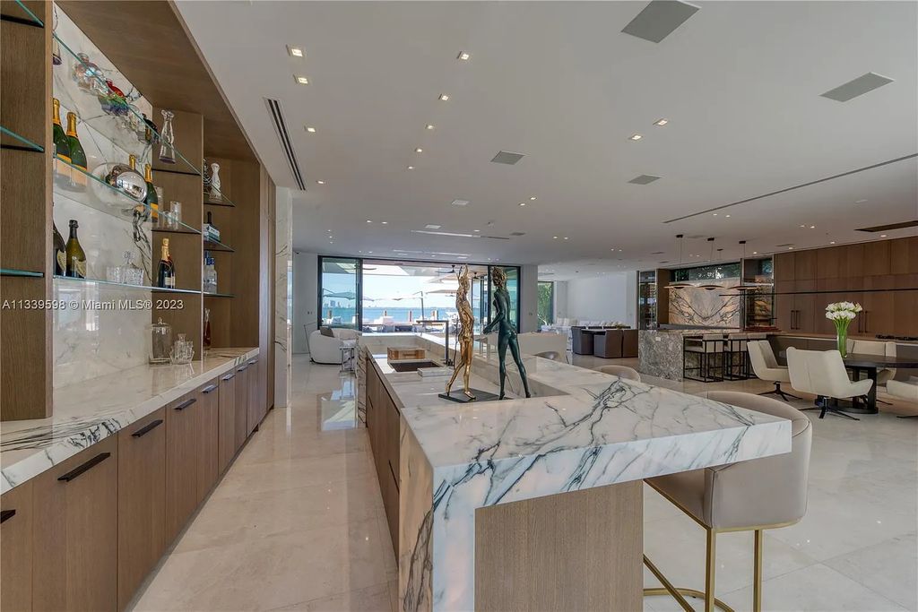 5718 N Bay Road, Miami Beach, Florida, is the perfect residence for luxury living. It features high-luxury furnishings and unmatched indoor/outdoor living spaces.