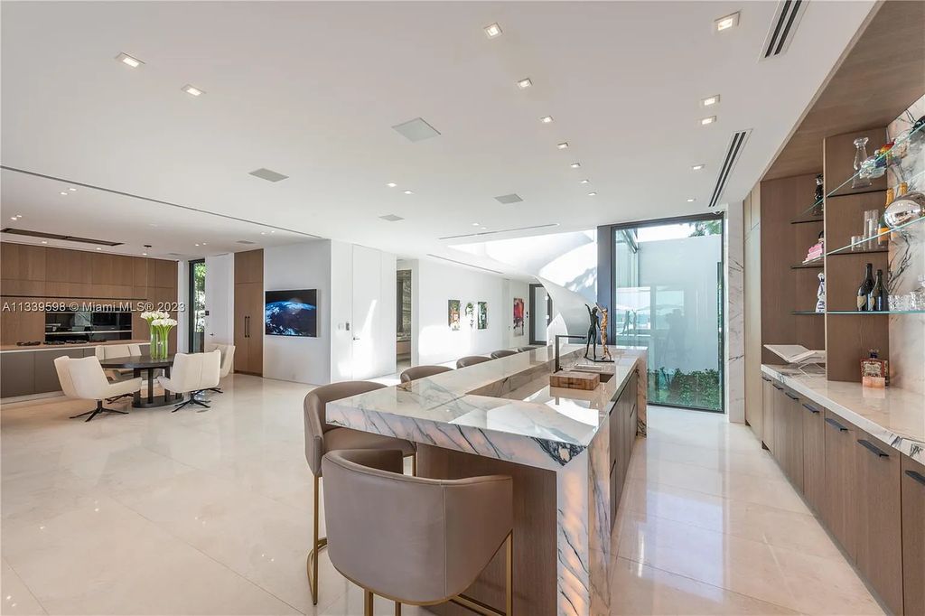 5718 N Bay Road, Miami Beach, Florida, is the perfect residence for luxury living. It features high-luxury furnishings and unmatched indoor/outdoor living spaces.