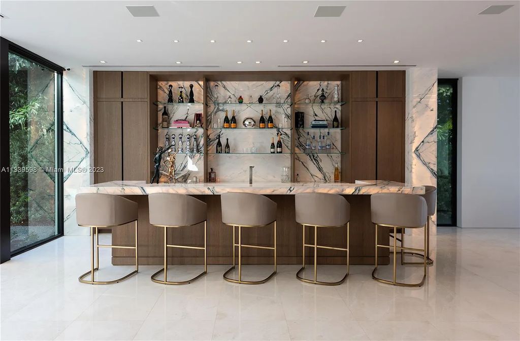 5718 N Bay Road, Miami Beach, Florida, is the perfect residence for luxury living. It features high-luxury furnishings and unmatched indoor/outdoor living spaces.
