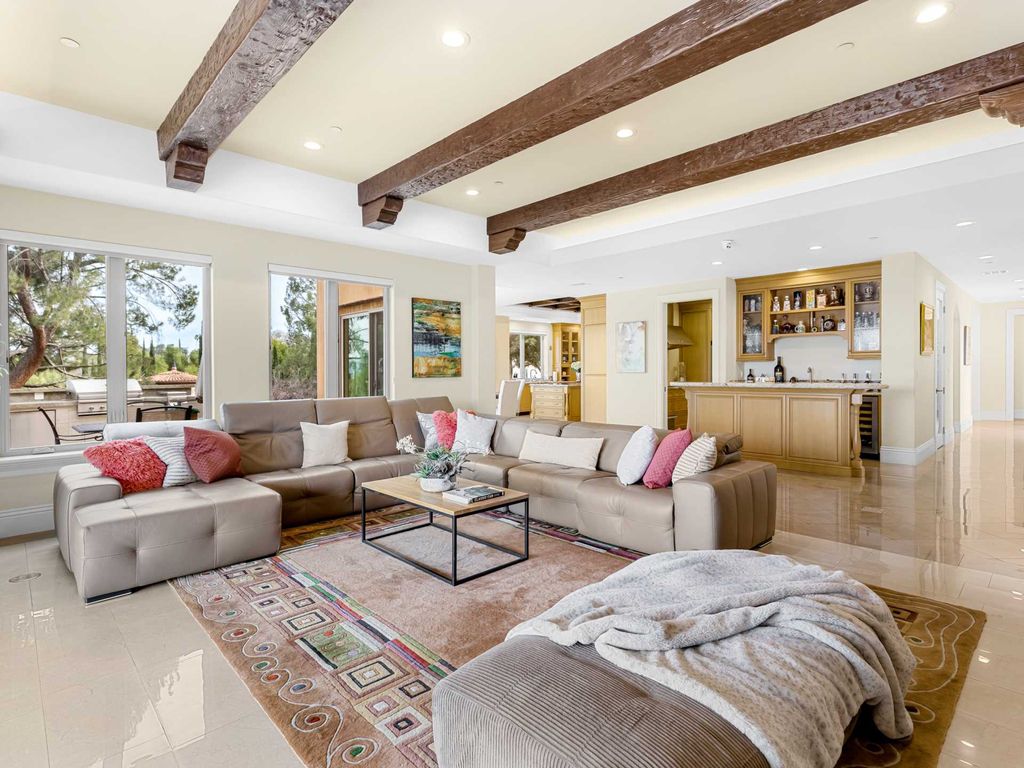 This beautiful Tuscany-inspired estate is located at 19609 W Citrus Ridge Dr, Tarzana, California. Built in 2015, the property sits on a vast 1.66-acre lot and boasts sweeping city light views. The house features 5 bedrooms and 7 bathrooms, with a living area of 6,581 square feet. 