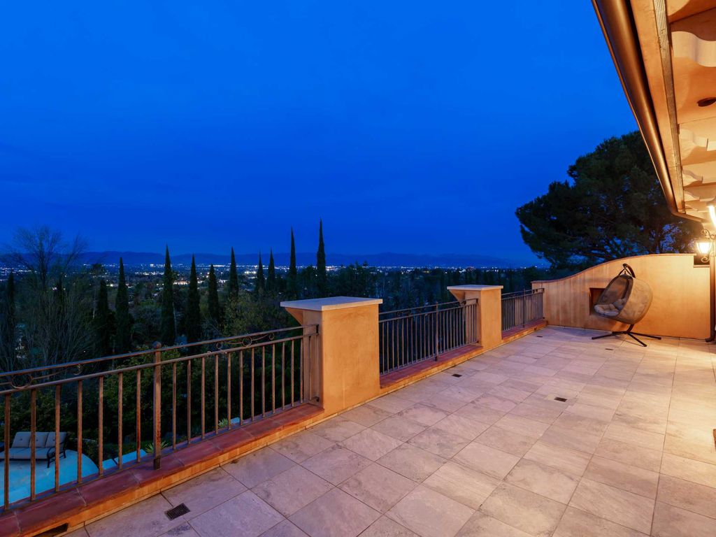 This beautiful Tuscany-inspired estate is located at 19609 W Citrus Ridge Dr, Tarzana, California. Built in 2015, the property sits on a vast 1.66-acre lot and boasts sweeping city light views. The house features 5 bedrooms and 7 bathrooms, with a living area of 6,581 square feet. 