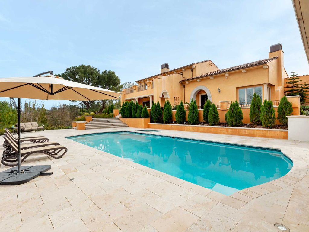 This beautiful Tuscany-inspired estate is located at 19609 W Citrus Ridge Dr, Tarzana, California. Built in 2015, the property sits on a vast 1.66-acre lot and boasts sweeping city light views. The house features 5 bedrooms and 7 bathrooms, with a living area of 6,581 square feet. 