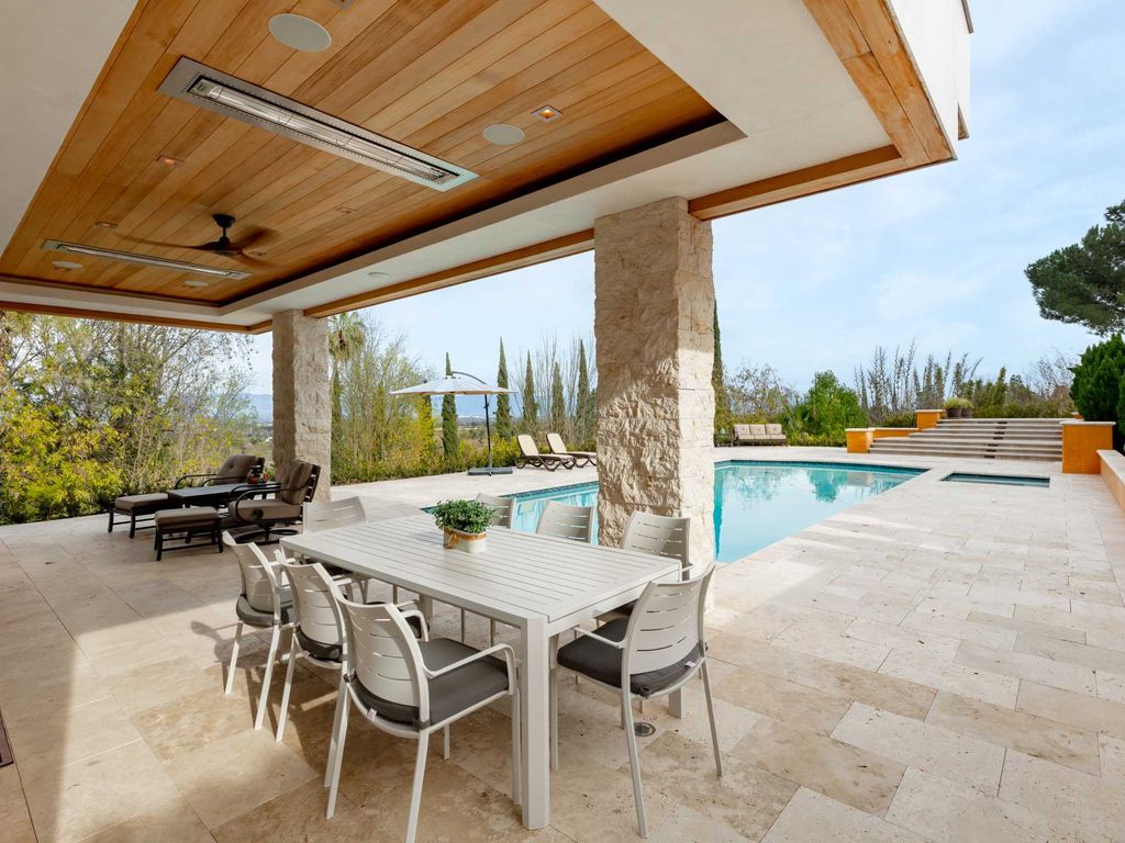 This beautiful Tuscany-inspired estate is located at 19609 W Citrus Ridge Dr, Tarzana, California. Built in 2015, the property sits on a vast 1.66-acre lot and boasts sweeping city light views. The house features 5 bedrooms and 7 bathrooms, with a living area of 6,581 square feet. 