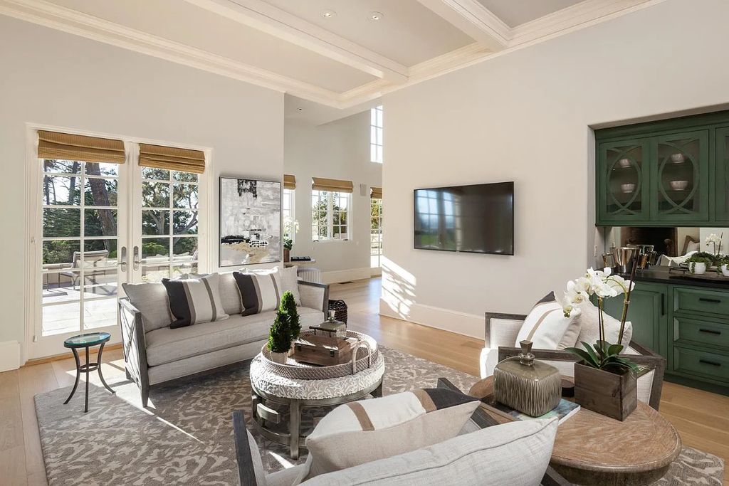 3410 Seventeen Mile Drive positioned on the 12th hole of the renowned Pebble Beach Golf Links, this property sits on a beautifully manicured 2.42-acre parcel, making it one of the largest properties on the course. The estate offers a gated entrance, ensuring privacy and security for its residents.