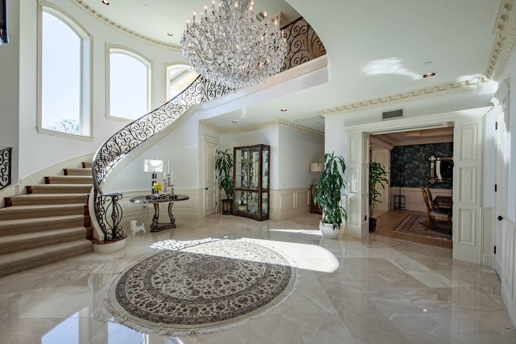 This North-facing French-inspired estate is located in the prestigious Bradbury Estates, an exclusive equestrian and estate community close to L.A., Pasadena, and the Santa Anita Race Track. Built in 2000 by Mur-sol, this custom estate boasts 6 bedrooms with walk-in closets, including a downstairs guest wing with a private bath, and a library.