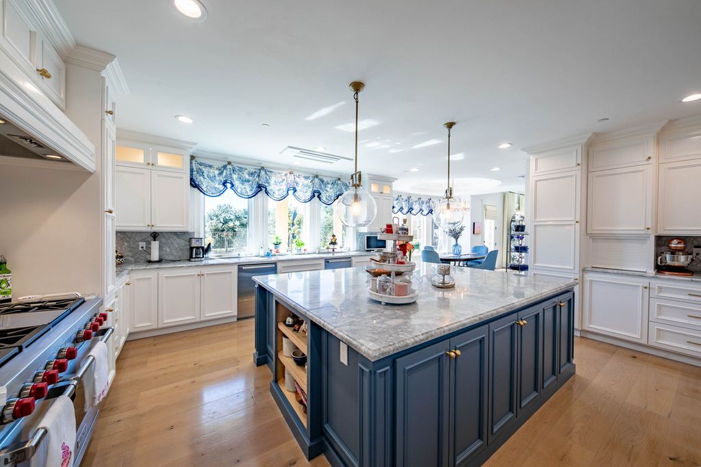 This North-facing French-inspired estate is located in the prestigious Bradbury Estates, an exclusive equestrian and estate community close to L.A., Pasadena, and the Santa Anita Race Track. Built in 2000 by Mur-sol, this custom estate boasts 6 bedrooms with walk-in closets, including a downstairs guest wing with a private bath, and a library.