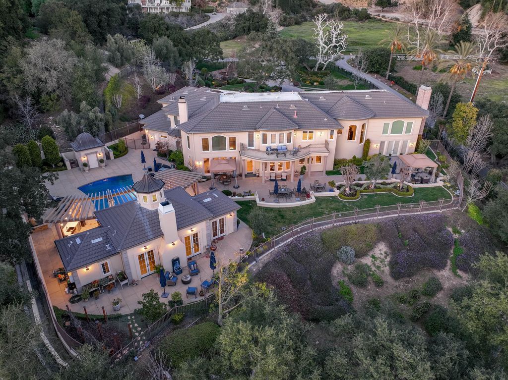 This North-facing French-inspired estate is located in the prestigious Bradbury Estates, an exclusive equestrian and estate community close to L.A., Pasadena, and the Santa Anita Race Track. Built in 2000 by Mur-sol, this custom estate boasts 6 bedrooms with walk-in closets, including a downstairs guest wing with a private bath, and a library.