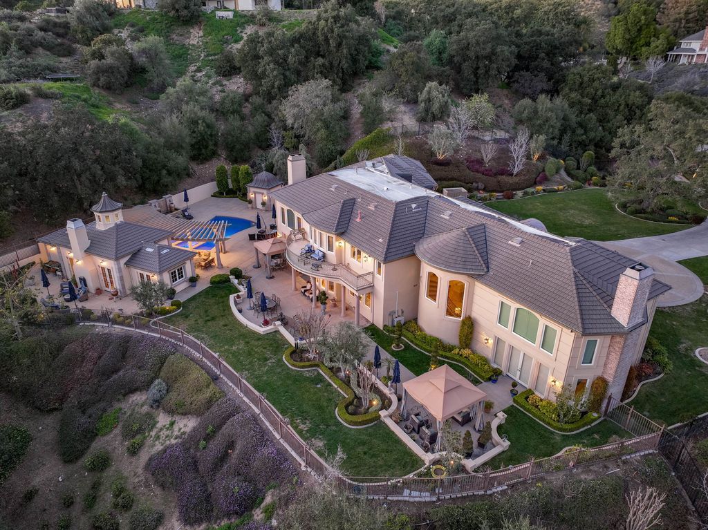 This North-facing French-inspired estate is located in the prestigious Bradbury Estates, an exclusive equestrian and estate community close to L.A., Pasadena, and the Santa Anita Race Track. Built in 2000 by Mur-sol, this custom estate boasts 6 bedrooms with walk-in closets, including a downstairs guest wing with a private bath, and a library.