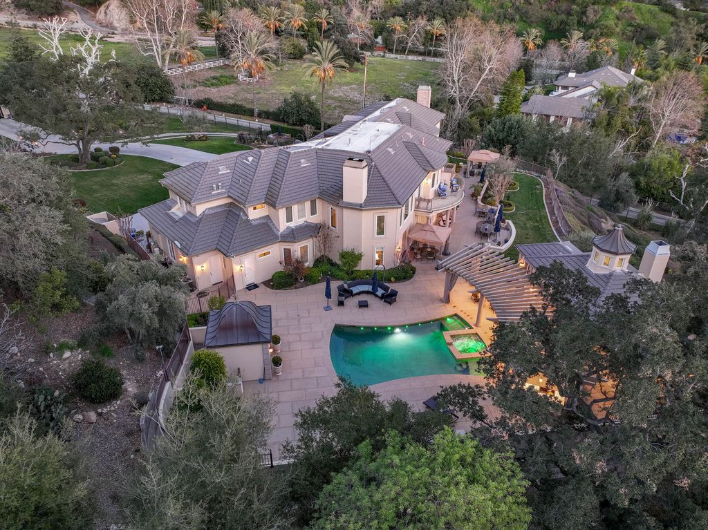 This North-facing French-inspired estate is located in the prestigious Bradbury Estates, an exclusive equestrian and estate community close to L.A., Pasadena, and the Santa Anita Race Track. Built in 2000 by Mur-sol, this custom estate boasts 6 bedrooms with walk-in closets, including a downstairs guest wing with a private bath, and a library.