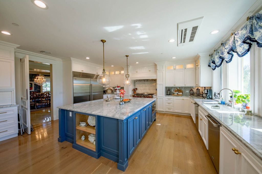 This North-facing French-inspired estate is located in the prestigious Bradbury Estates, an exclusive equestrian and estate community close to L.A., Pasadena, and the Santa Anita Race Track. Built in 2000 by Mur-sol, this custom estate boasts 6 bedrooms with walk-in closets, including a downstairs guest wing with a private bath, and a library.