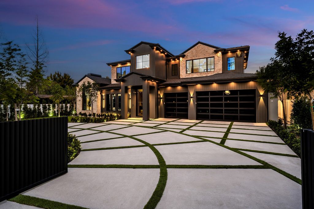 The recently built gated estate at 4508 Haskell Ave in Encino's prestigious Royal Oaks community is a true masterpiece of luxury and design. Upon entering the property, guests are welcomed by an impressive wide entry hallway with ultra-high ceilings and European oak floors. The hallway leads to the stunning living room with stone entertainment bars and a formal dining room with a fireplace and private patio.