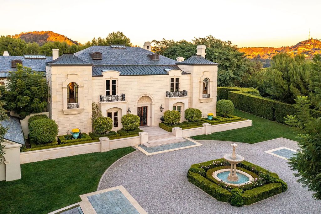 55 Beverly Park is a grand-scale residence located in the exclusive guard-gated enclave of Beverly Park. This luxurious estate, expertly designed by acclaimed architect Bob Ray Offenhauser, exudes an air of French Chateau meets Southern California living, and sits on 2.89 acres of romantic French-style garden landscaping.