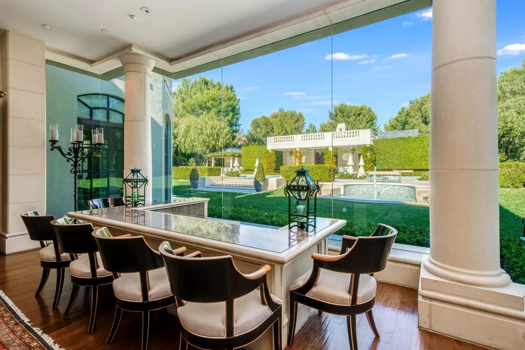 55 Beverly Park is a grand-scale residence located in the exclusive guard-gated enclave of Beverly Park. This luxurious estate, expertly designed by acclaimed architect Bob Ray Offenhauser, exudes an air of French Chateau meets Southern California living, and sits on 2.89 acres of romantic French-style garden landscaping.