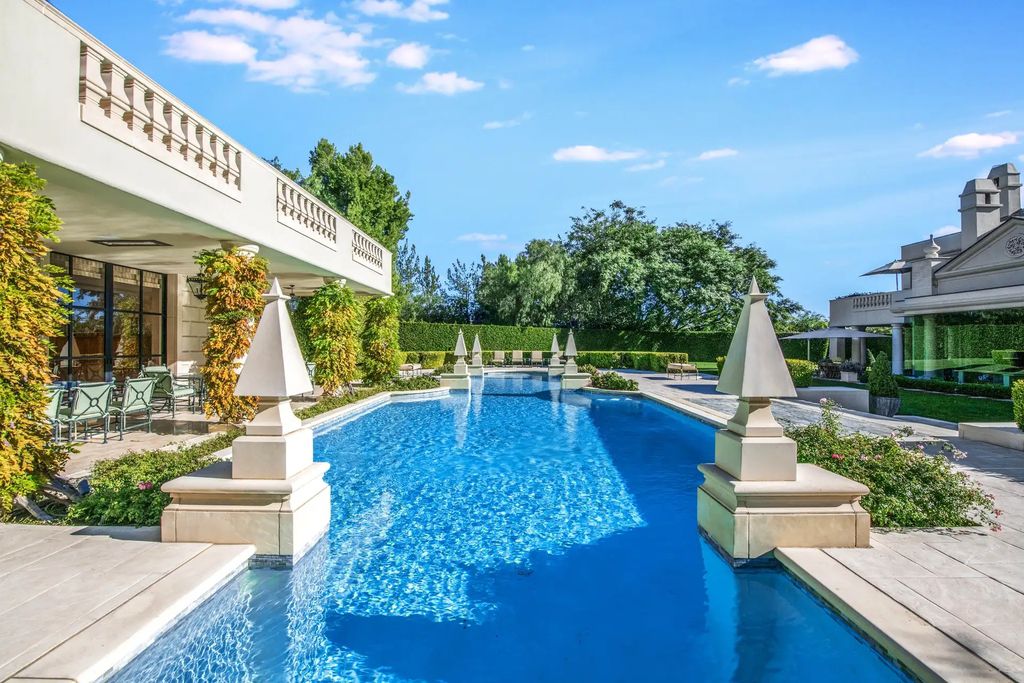 55 Beverly Park is a grand-scale residence located in the exclusive guard-gated enclave of Beverly Park. This luxurious estate, expertly designed by acclaimed architect Bob Ray Offenhauser, exudes an air of French Chateau meets Southern California living, and sits on 2.89 acres of romantic French-style garden landscaping.