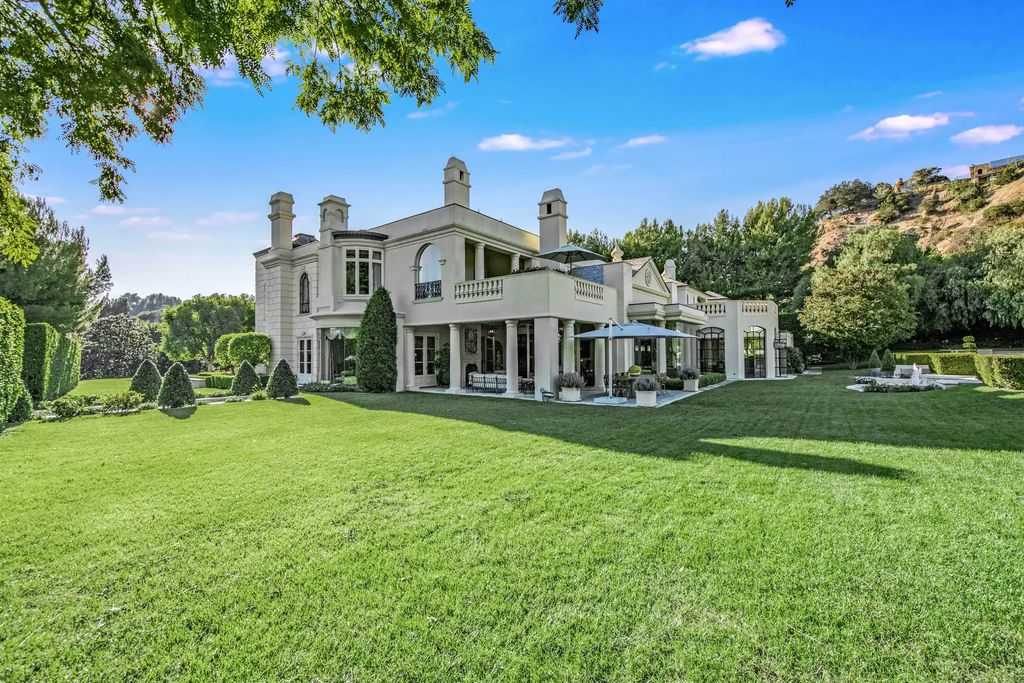 55 Beverly Park is a grand-scale residence located in the exclusive guard-gated enclave of Beverly Park. This luxurious estate, expertly designed by acclaimed architect Bob Ray Offenhauser, exudes an air of French Chateau meets Southern California living, and sits on 2.89 acres of romantic French-style garden landscaping.