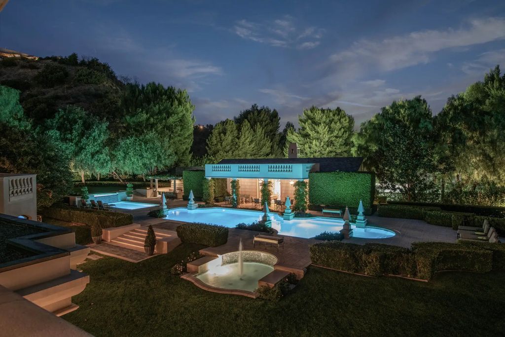 55 Beverly Park is a grand-scale residence located in the exclusive guard-gated enclave of Beverly Park. This luxurious estate, expertly designed by acclaimed architect Bob Ray Offenhauser, exudes an air of French Chateau meets Southern California living, and sits on 2.89 acres of romantic French-style garden landscaping.