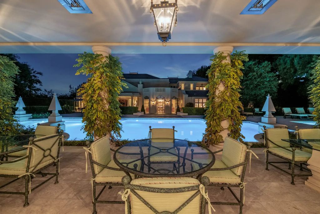 55 Beverly Park is a grand-scale residence located in the exclusive guard-gated enclave of Beverly Park. This luxurious estate, expertly designed by acclaimed architect Bob Ray Offenhauser, exudes an air of French Chateau meets Southern California living, and sits on 2.89 acres of romantic French-style garden landscaping.