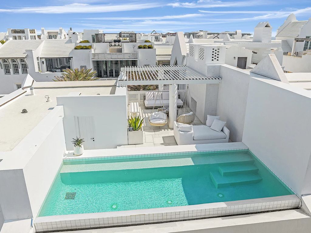 This stunning modernist retreat in the heart of Alys Beach, located at 116 S Charles Street, Inlet Beach, Florida, is a bespoke light-filled home with extraordinary architectural styling and sophisticated interior design.