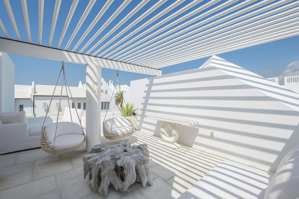 This stunning modernist retreat in the heart of Alys Beach, located at 116 S Charles Street, Inlet Beach, Florida, is a bespoke light-filled home with extraordinary architectural styling and sophisticated interior design.