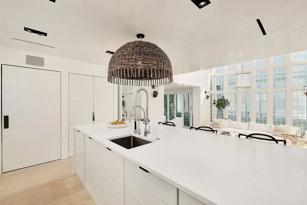 This stunning modernist retreat in the heart of Alys Beach, located at 116 S Charles Street, Inlet Beach, Florida, is a bespoke light-filled home with extraordinary architectural styling and sophisticated interior design.
