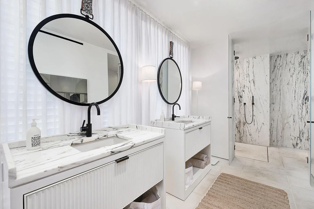 This stunning modernist retreat in the heart of Alys Beach, located at 116 S Charles Street, Inlet Beach, Florida, is a bespoke light-filled home with extraordinary architectural styling and sophisticated interior design.