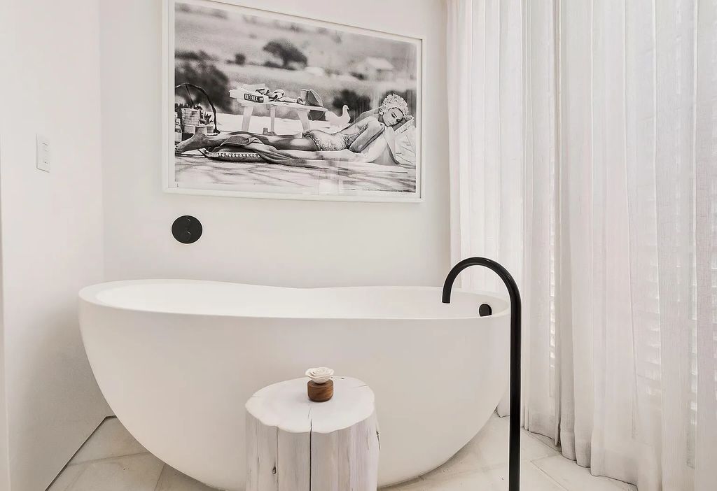This stunning modernist retreat in the heart of Alys Beach, located at 116 S Charles Street, Inlet Beach, Florida, is a bespoke light-filled home with extraordinary architectural styling and sophisticated interior design.