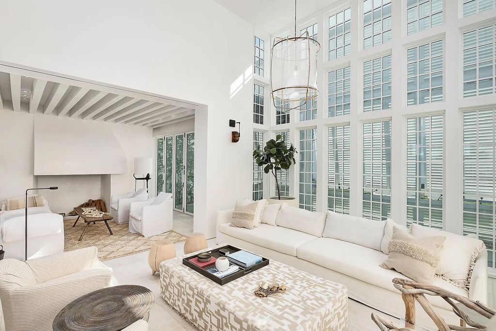 This stunning modernist retreat in the heart of Alys Beach, located at 116 S Charles Street, Inlet Beach, Florida, is a bespoke light-filled home with extraordinary architectural styling and sophisticated interior design.