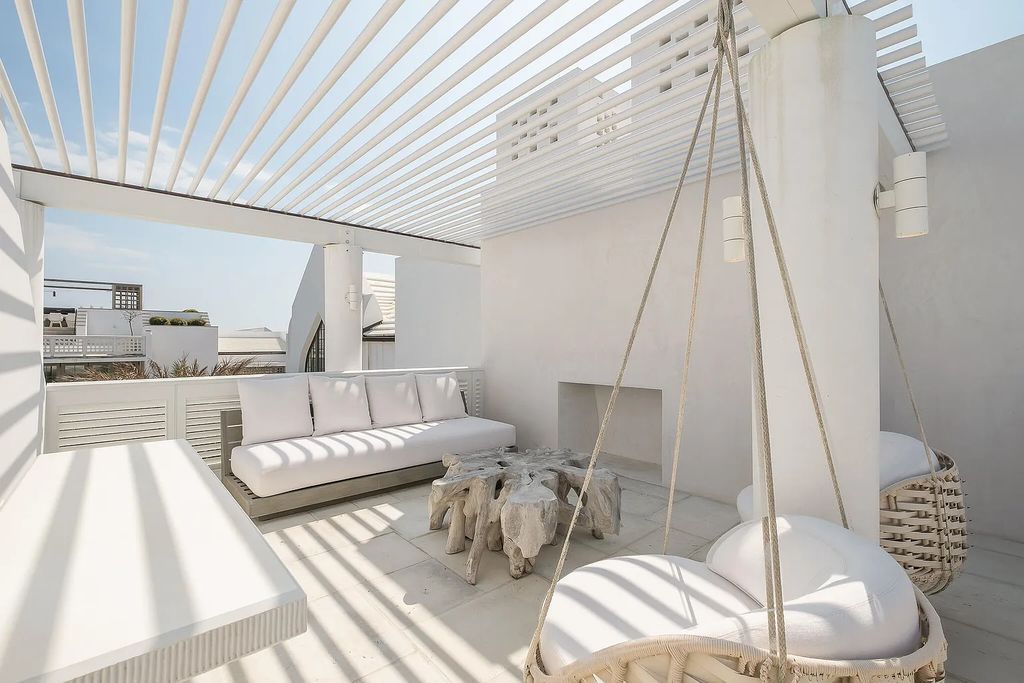 This stunning modernist retreat in the heart of Alys Beach, located at 116 S Charles Street, Inlet Beach, Florida, is a bespoke light-filled home with extraordinary architectural styling and sophisticated interior design.