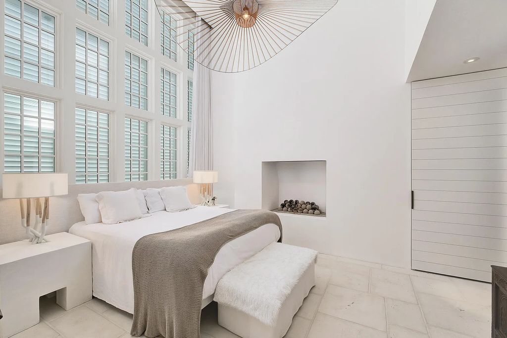 This stunning modernist retreat in the heart of Alys Beach, located at 116 S Charles Street, Inlet Beach, Florida, is a bespoke light-filled home with extraordinary architectural styling and sophisticated interior design.