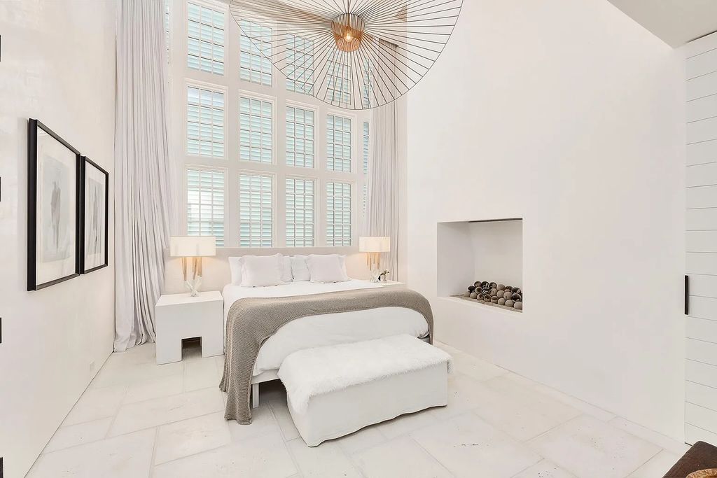 This stunning modernist retreat in the heart of Alys Beach, located at 116 S Charles Street, Inlet Beach, Florida, is a bespoke light-filled home with extraordinary architectural styling and sophisticated interior design.