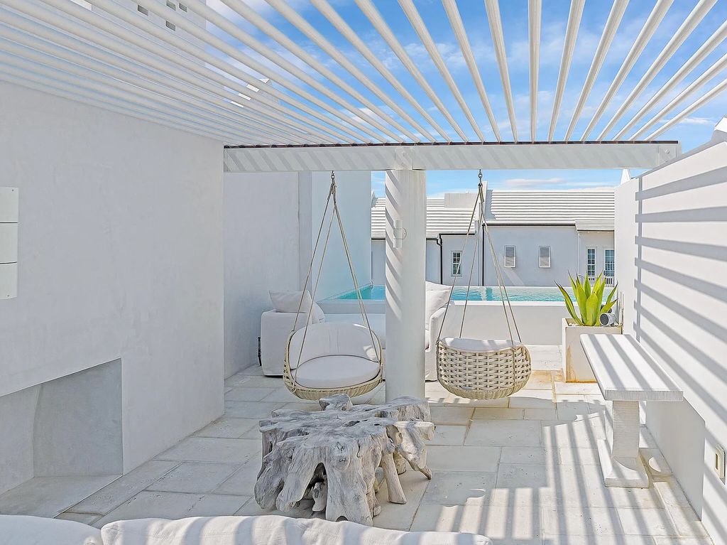 This stunning modernist retreat in the heart of Alys Beach, located at 116 S Charles Street, Inlet Beach, Florida, is a bespoke light-filled home with extraordinary architectural styling and sophisticated interior design.