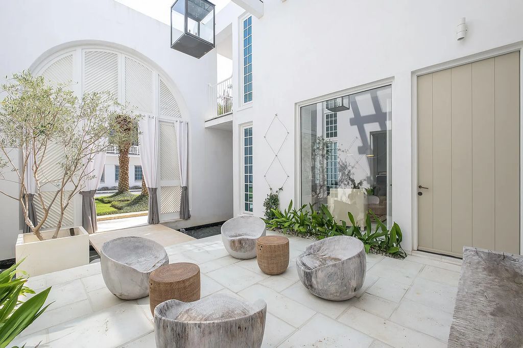 This stunning modernist retreat in the heart of Alys Beach, located at 116 S Charles Street, Inlet Beach, Florida, is a bespoke light-filled home with extraordinary architectural styling and sophisticated interior design.