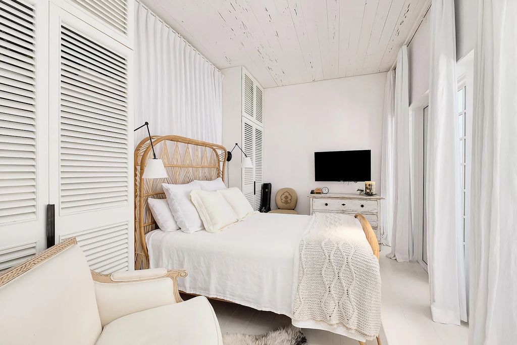 This stunning modernist retreat in the heart of Alys Beach, located at 116 S Charles Street, Inlet Beach, Florida, is a bespoke light-filled home with extraordinary architectural styling and sophisticated interior design.