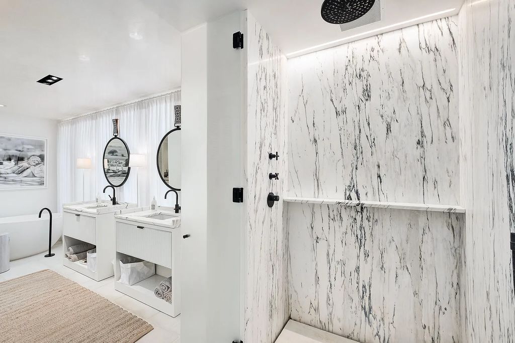 This stunning modernist retreat in the heart of Alys Beach, located at 116 S Charles Street, Inlet Beach, Florida, is a bespoke light-filled home with extraordinary architectural styling and sophisticated interior design.
