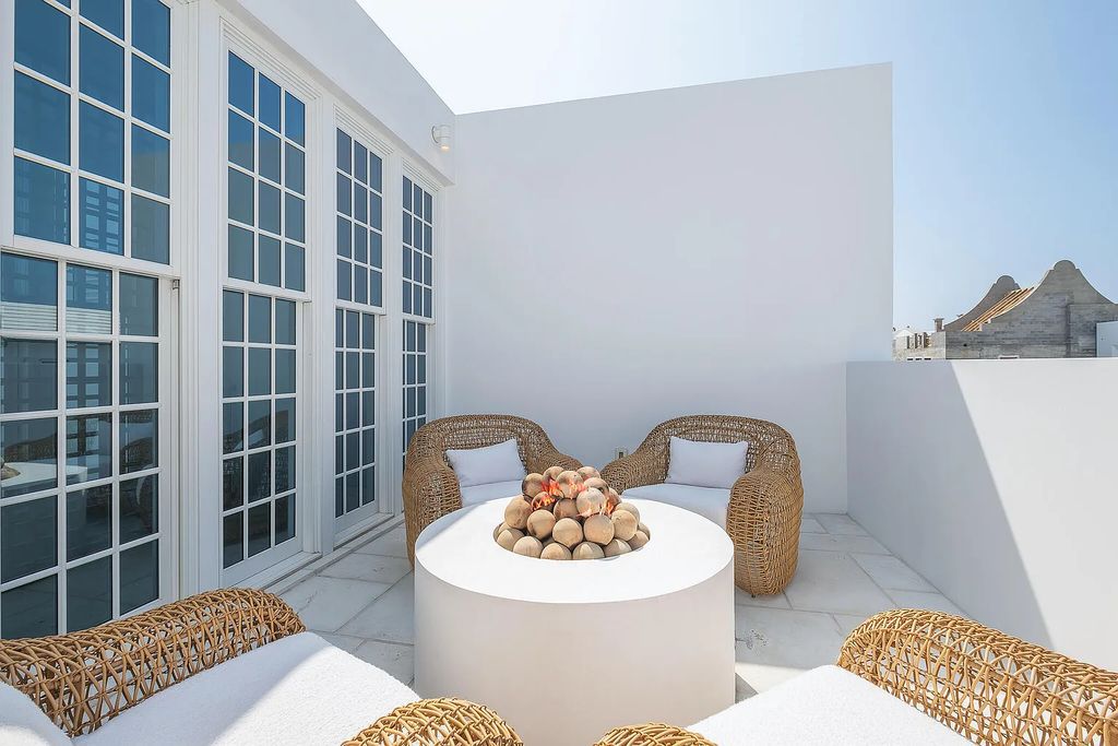 This stunning modernist retreat in the heart of Alys Beach, located at 116 S Charles Street, Inlet Beach, Florida, is a bespoke light-filled home with extraordinary architectural styling and sophisticated interior design.